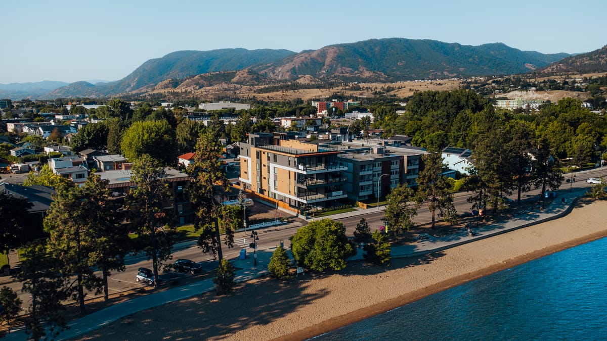 Aerial view of Legacy on Lakeshore on the Penticton waterfront with the Okanagan hills behind