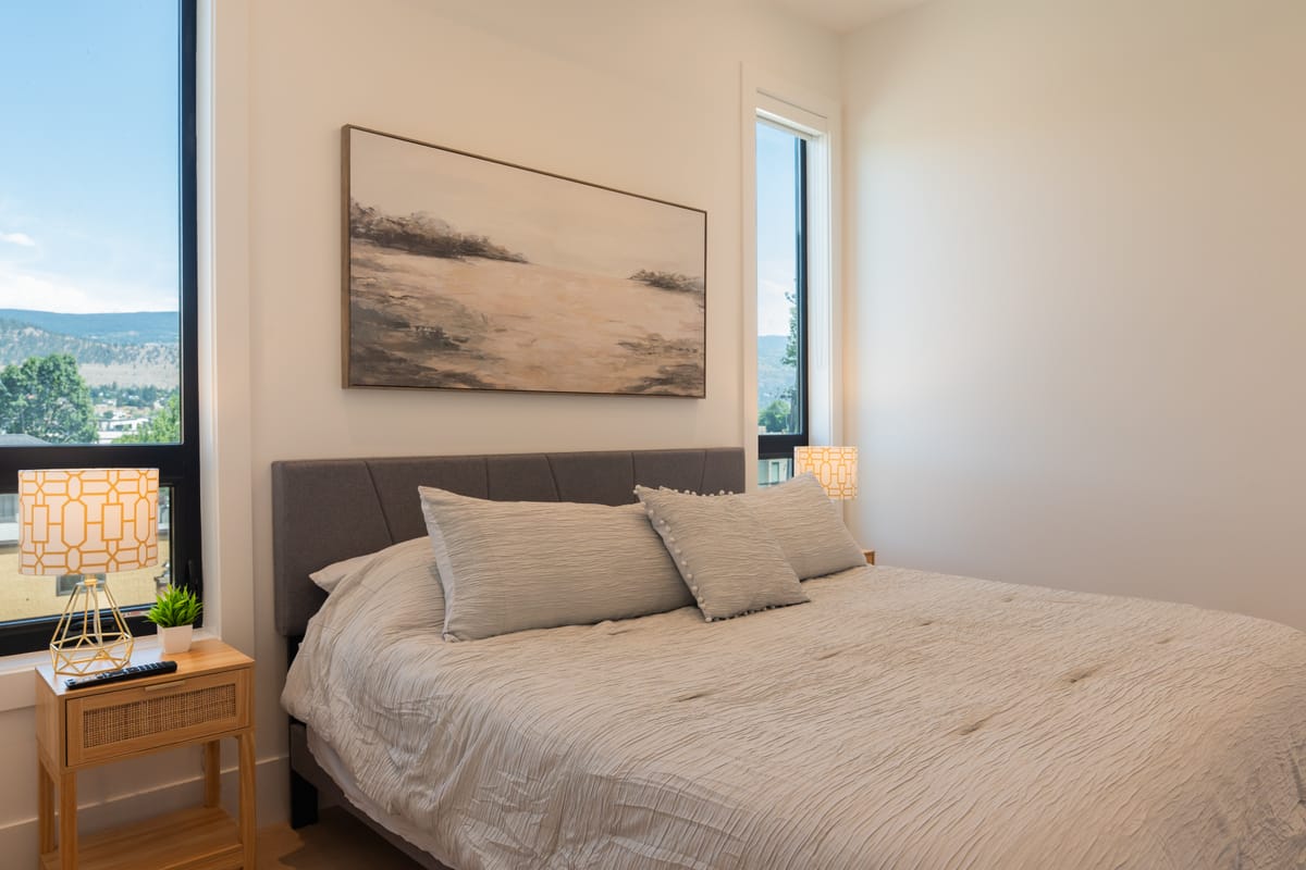 Bedroom with a view over the hills through a corner window